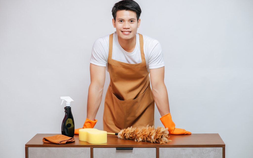young-man-and-cleaning-equipment-on-furniture-at-h-2021-09-04-01-59-24-utc.jpg